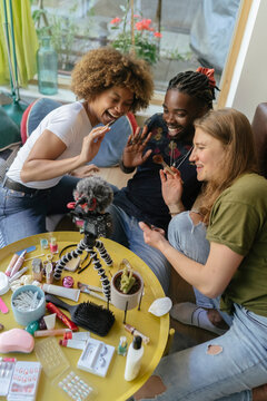 Three Friends Filming a Makeup tutorial
