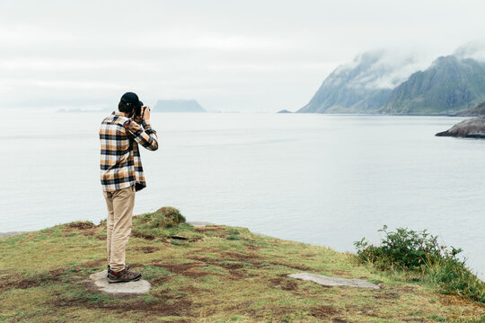 Tourist take photo fjord Norway