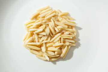 A top down view of a pile of slivered almonds.
