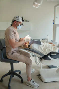 the woman consults a dentist