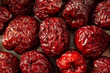 A top down view of a layer of dried apple jujube, as a background.