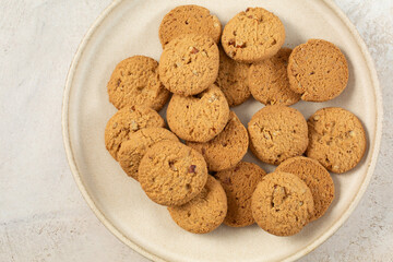 A top down view of a plate of gluten-free almond flour pecan cookies.