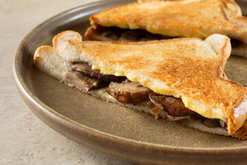 A view of a gluten-free, dairy-free mushroom and cheese sandwich.