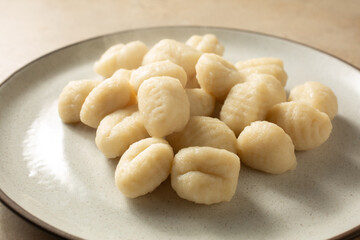 A view of a plate of cooked gluten-free gnocchi.