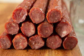 A closeup view of a pile of beef sticks.