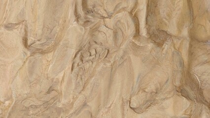 Natural beige stone texture with detailed organic patterns, perfect for use as a background, wall material, or design overlay. High-resolution sandstone surface suitable for architecture, interior