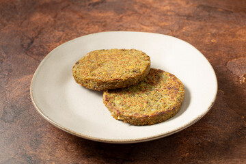 A view of some mushroom patties, on a plate.
