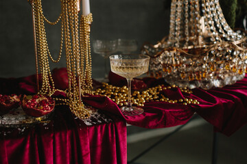 Sparkling holiday champagne on decorated Christmas table with ornaments.
