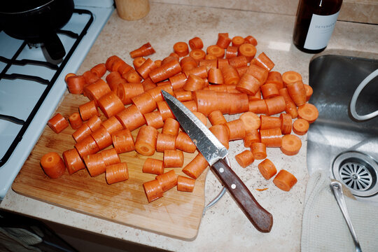 Chopped Carrots Arranged on a Cutting Board in a Kitchen Setting