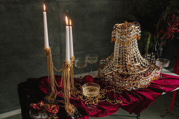 Elegant holiday table decor with sparkling candles and glass ornaments.