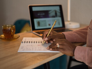 Woman budgeting in notebook 