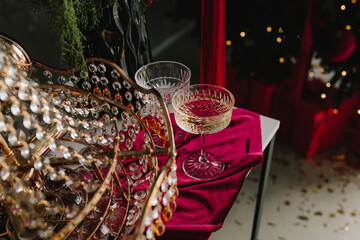 Christmas table with sparkling glass ornaments and candlelight.