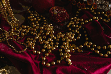 Table decorated for Christmas with glowing candles and glass ornaments.