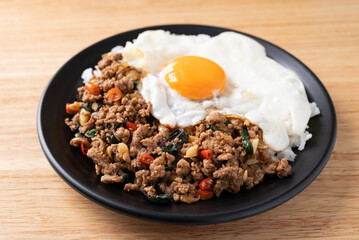 Thai food, Stir fried holy basil with minced pork with cooked rice and fried egg on top