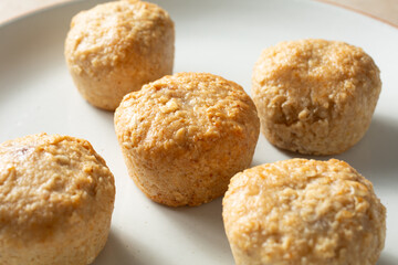 A view of a plate of dairy-free, gluten-free stuffed oat bites.
