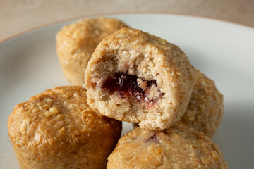 A view of a plate of dairy-free, gluten-free stuffed oat bites.