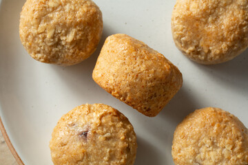 A top down view of a plate of dairy-free, gluten-free stuffed oat bites.