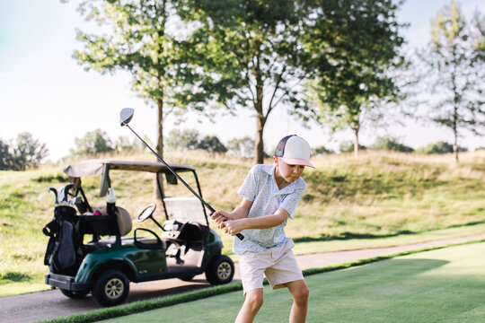boy playing golf