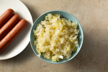 A top down view of a bowl of sauerkraut.