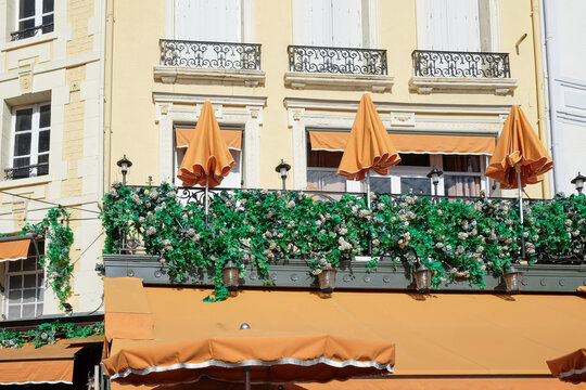 Balcony with Orange Parasols