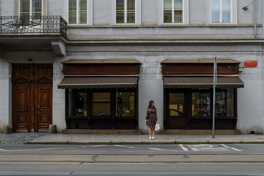 Woman in Front of Traditional Shop in Prague