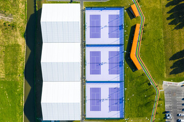 tennis court aerial view with purple surface in free public area