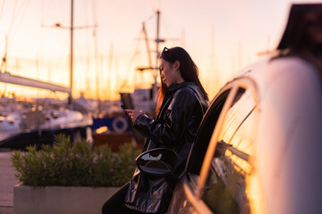 Relaxed woman using smartphone app