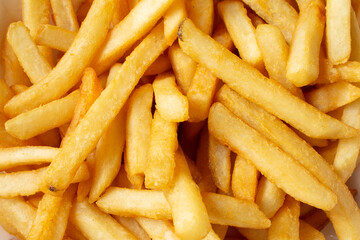 A top down view of a pile of french fries, as a background.