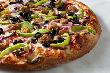 A view of a supreme pizza.