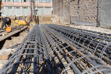 Rebar cages lying on ground at construction site