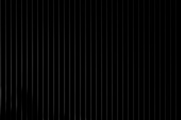 Obraz premium Abstract dark background with vertical parallel lines creating a subtle ribbed or corrugated texture in a minimalist, modern style