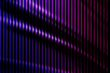 Abstract background with vertical lines illuminated by dramatic purple and blue neon light creating a futuristic or technological pattern