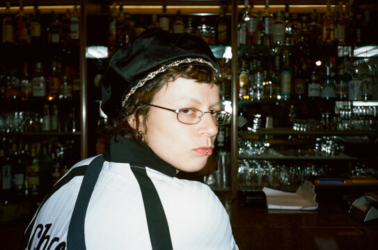 Girl With Unique Style depicted at a bar counter.