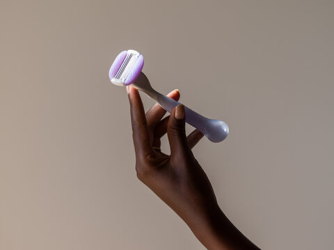 Hand holding razor
