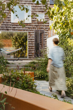 Contemporary Garden Design with Curved Seating and Flower Borders
