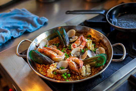 Freshly cooked seafood paella in a restaurant kitchen