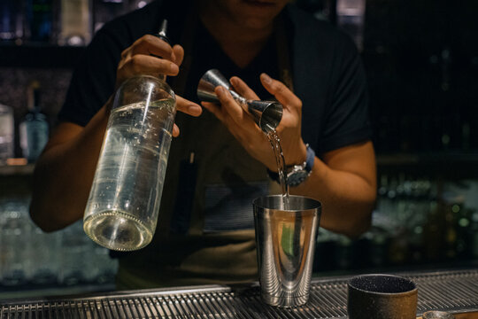 Bartender making a cocktail at a bar