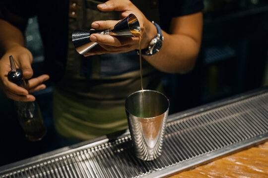 Bartender making a cocktail at a bar