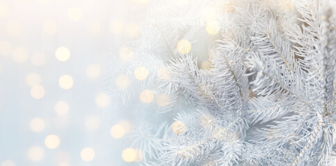 Christmas greeting card with fir tree branches and bokeh lights. Banner design