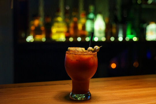 Refreshing Cocktail Served in a Bar With Colorful Backdrop