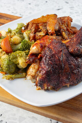 A view of a half chicken combo plate.