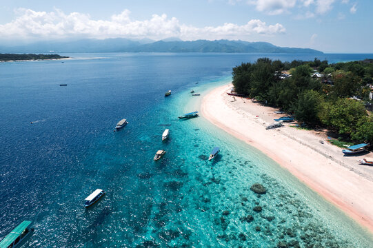 ropical Coastline with Distant Mountains at the Gili Islands 