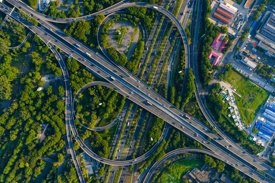 Aerial view of urban highway interchange with traffic