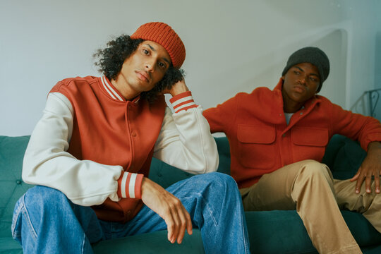 Fashion Duo Relaxing on Sofa
