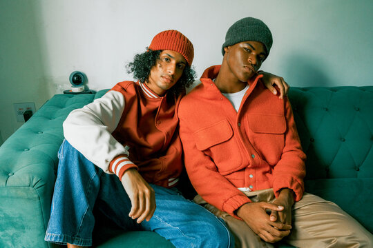 Fashion Duo Relaxing on Sofa