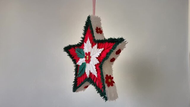 Minimalist Mexican star pi&ntilde;ata with geometric embroidery patterns on warm cream background. Elegant handcrafted holiday cultural symbol.