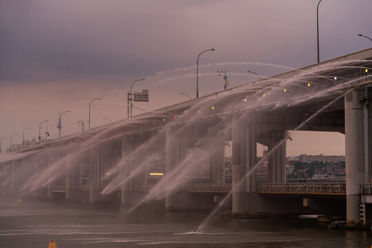 Fireworks Display Sprays Water From Bridge During Evening Hours