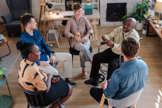 Inclusive group meeting engaged in conversation