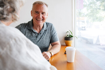 Smiling elder having a friendly conversation