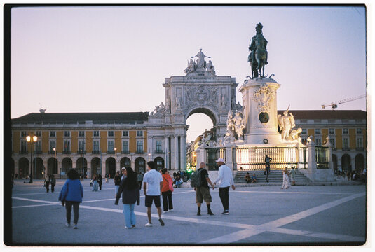 Golden Hour in Praca Do Comercio With Tourists and Historic Buildings